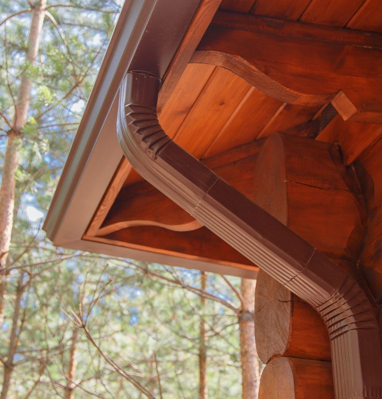 roof-gutter-system-on-log-house-in-forest-2023-11-27-05-09-44-utc roof-gutter-system-on-log-house-in-forest-2023-11-27-05-09-44-utc